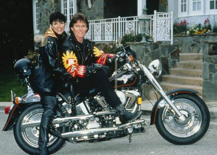 US athlete Bruce Jenner poses on a Harley-Davidson with his partner Kris Jenner, formerly Kris Kardashian, circa 1991. (Photo by Maureen Donaldson/Getty Images)