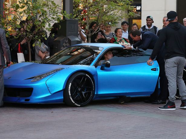 justin-bieber-drinks-a-coffee-whilst-leaving-the-grove-in-his-ferrari-in-west-hollywood-california